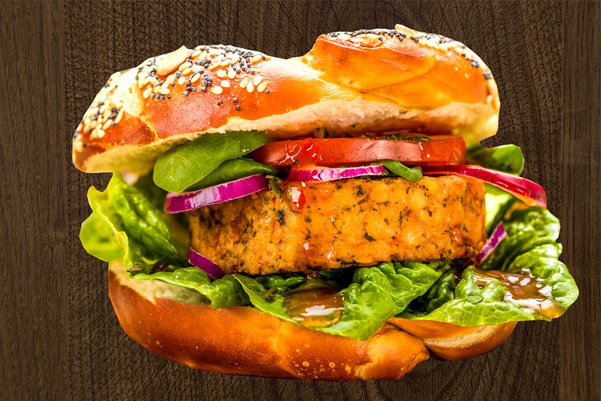 Vegetarian / vegetable burger (80g) with lettuce, cucumber, tomato, onion with sauces in a golden bun